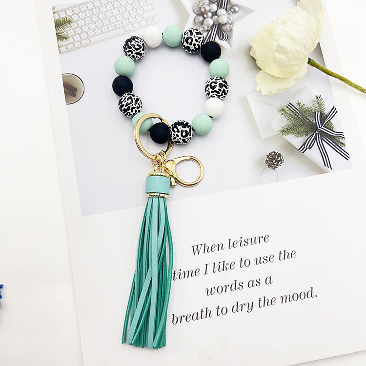 Wholesale Leopard Print White Bottom Wooden Beads Rubber Paint Round Beads PU Tassel Bracelet Keychain